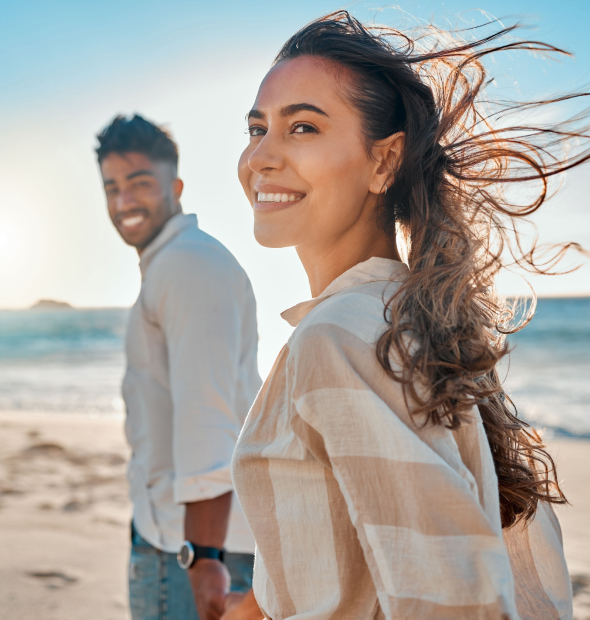 Couple smiling on the beach