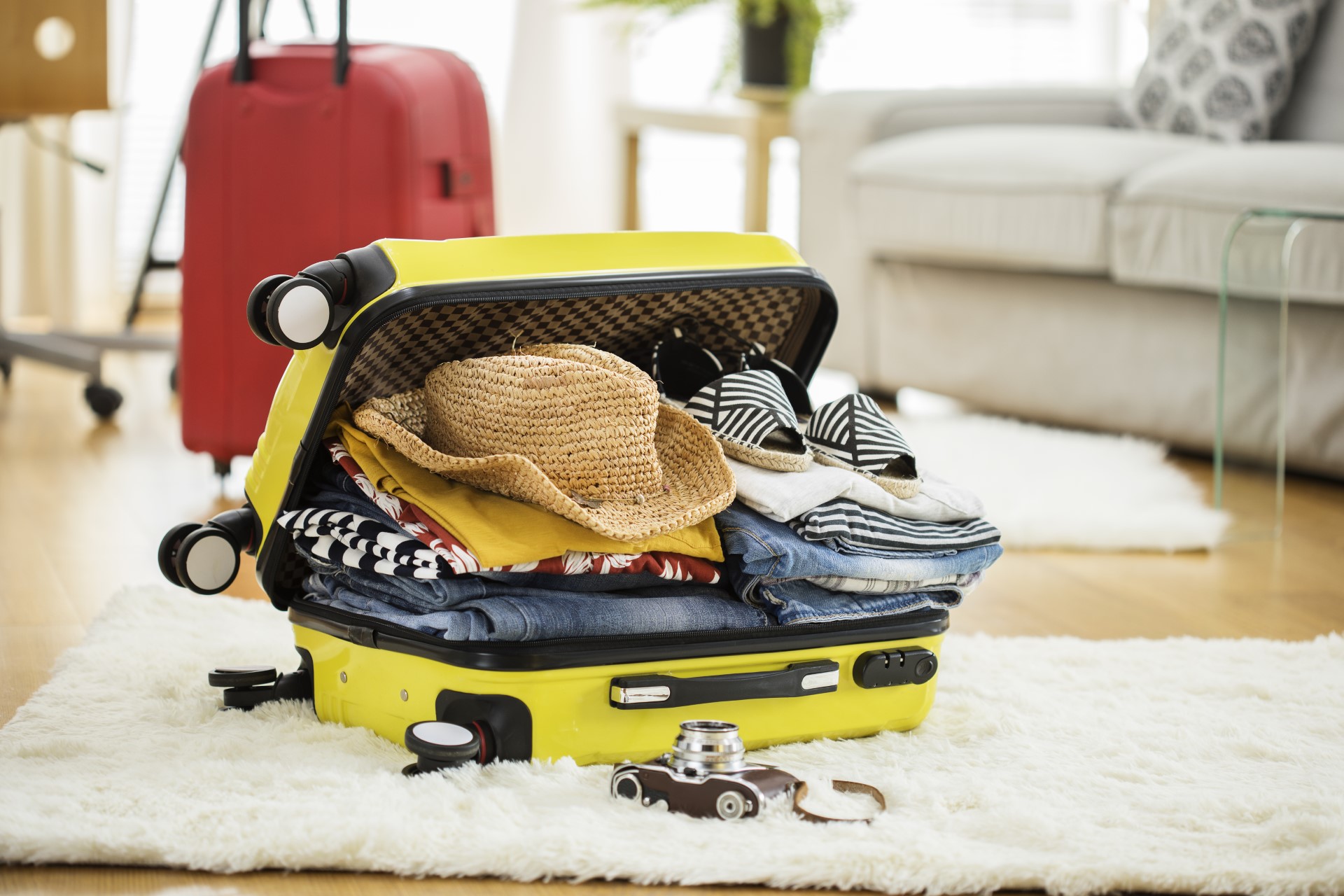 Open suitcase packed for a trip