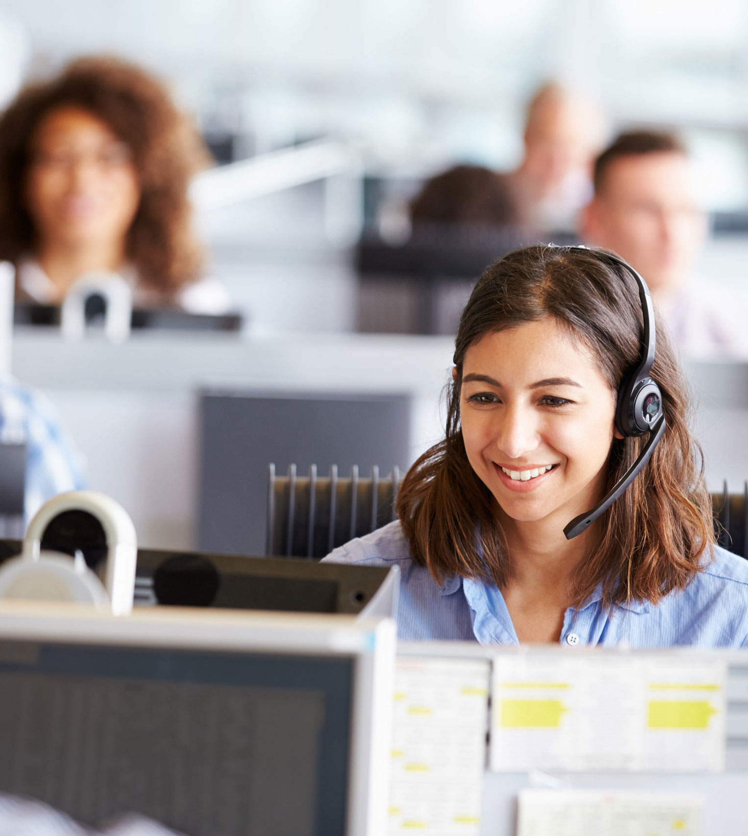 Customer service agent smiling on a headset call